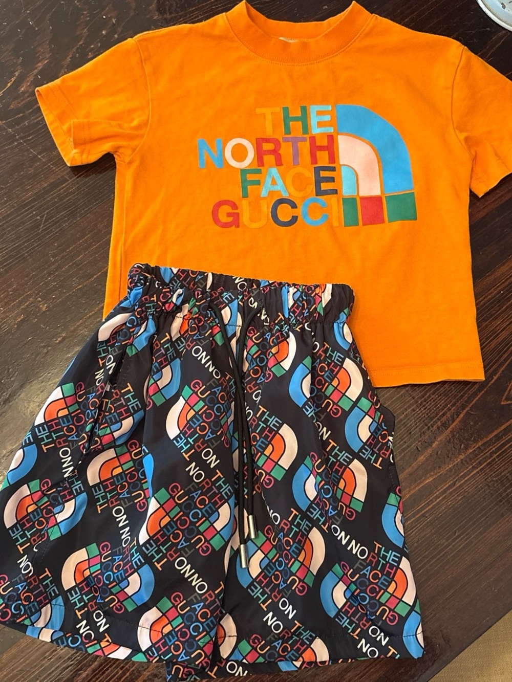 The North Face Gucci Collab Kids Orange Logo Tee & Multi-Color Logo Shorts Set